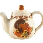 a teapot decorated for a harvest season